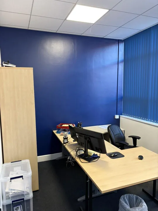 Office painted with a navy blue feature wall, Dumfries commercial decorating